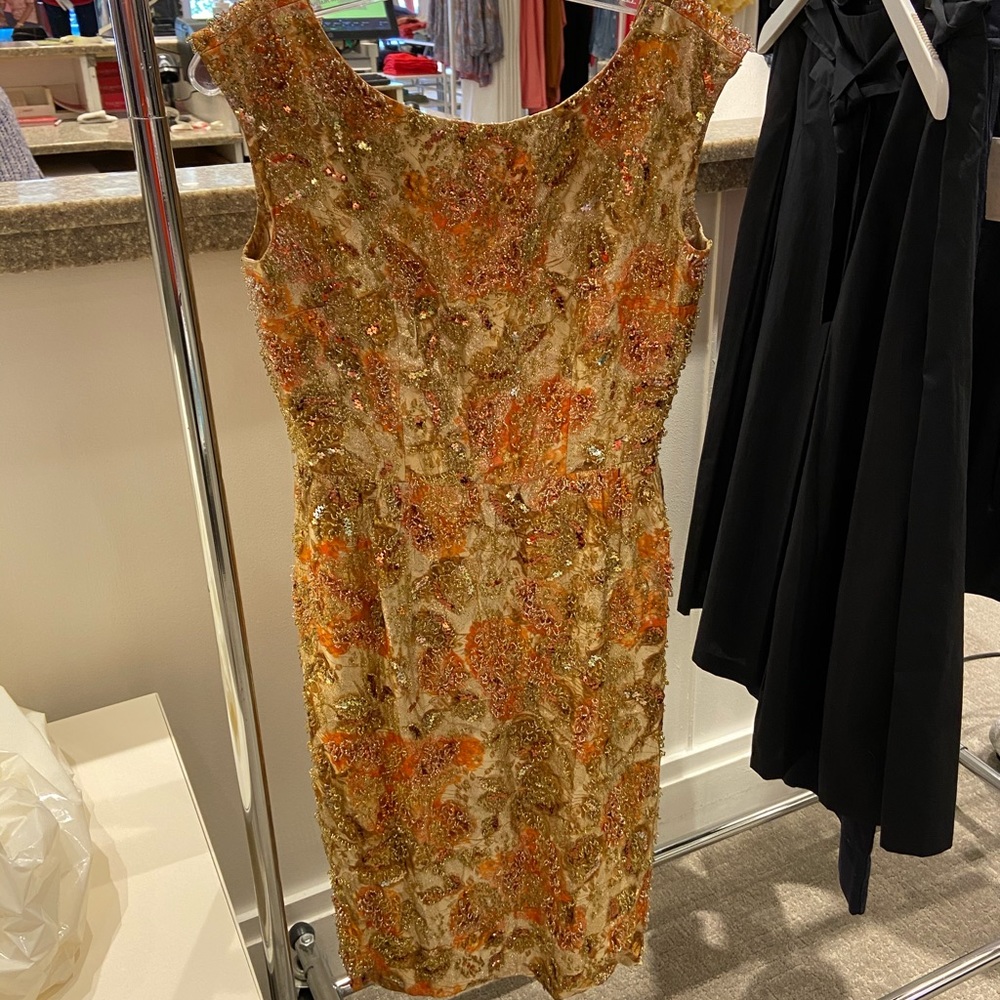 Hand made and hand beaded in 1950 as 4 dress